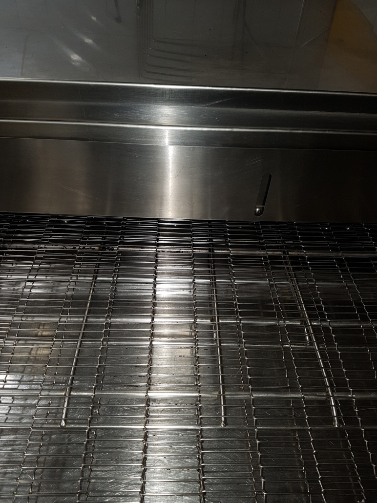 Gleaming stainless steel grill racks after a Cleanfellas deep clean